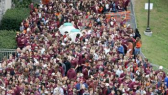 Virginia Tech students make their way from tailgating at Center Street to Lane Stadium before a football game last year.
